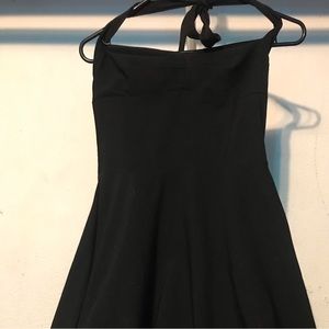 Black dress with a pink under ruffle